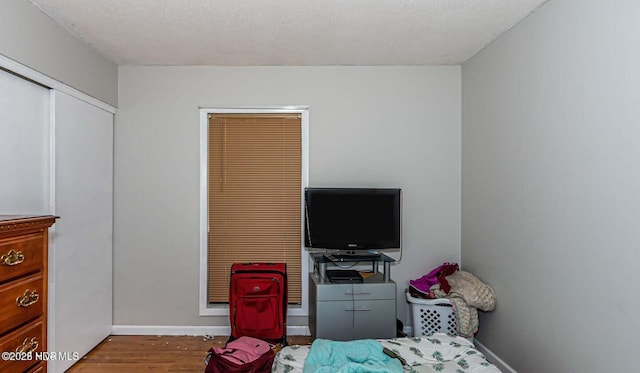 105 Woodside Ct, Jacksonville, NC 28546 - bedroom with wood finished floors and baseboards