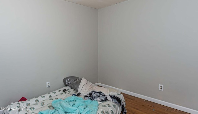 105 Woodside Ct, Jacksonville, NC 28546 - bedroom with baseboards and wood finished floors