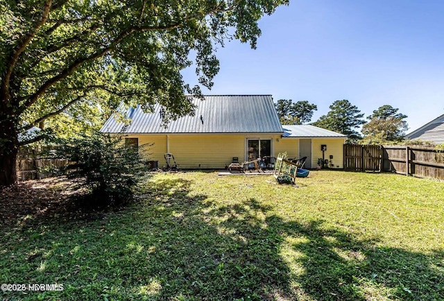 105 Woodside Ct, Jacksonville, NC 28546 - back of house with a metal roof and a fenced backyard
