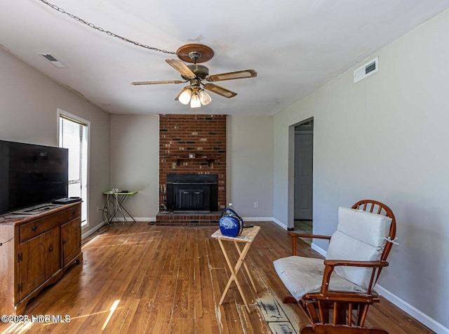 105 Woodside Ct, Jacksonville, NC 28546 - living area featuring hardwood / wood-style floors, ceiling fan, and a fireplace