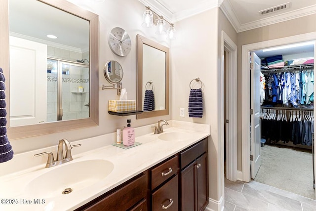 26 Calhoun Ln, Pinehurst, NC 28374 - bathroom featuring double vanity, a walk in closet, crown molding, and a stall shower