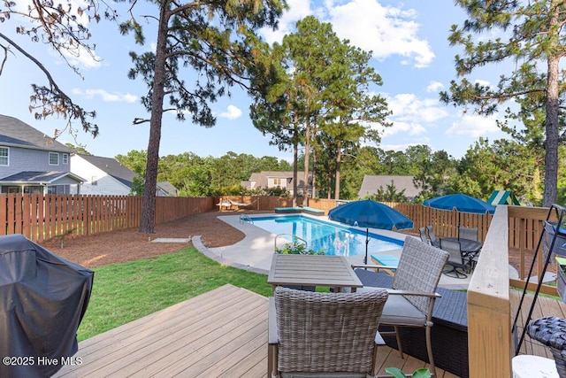 26 Calhoun Ln, Pinehurst, NC 28374 - view of swimming pool with a wooden deck, a fenced backyard, outdoor dining space, and grilling area
