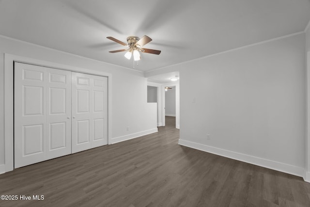 350 Hubert Blvd, Hubert, NC 28539 - unfurnished bedroom with dark wood finished floors, a closet, crown molding, and a ceiling fan
