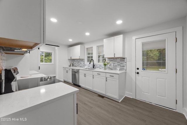 350 Hubert Blvd, Hubert, NC 28539 - kitchen with dishwasher, light wood-type flooring, white cabinets, backsplash, and recessed lighting