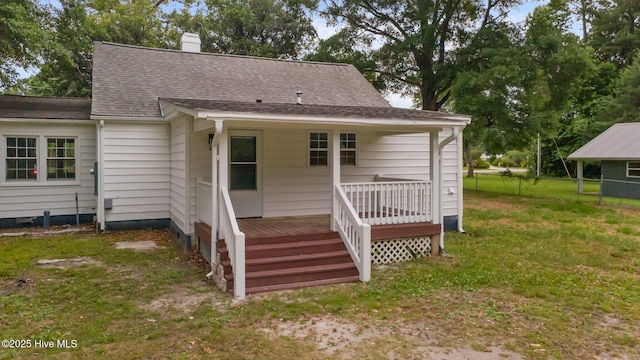 350 Hubert Blvd, Hubert, NC 28539 - rear view of property with a wooden deck, a chimney, and roof with shingles