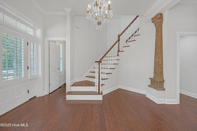 311 S Kingfisher Ln, Hampstead, NC 28443 - foyer with wood finished floors, stairs, ornamental molding, and ornate columns