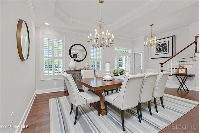 311 S Kingfisher Ln, Hampstead, NC 28443 - dining room with a chandelier, wood finished floors, a tray ceiling, ornamental molding, and recessed lighting