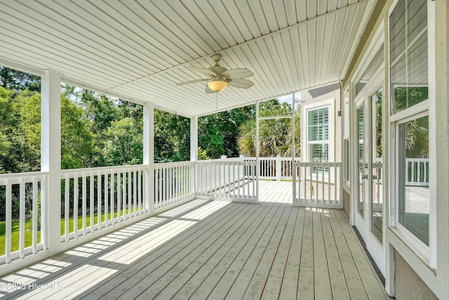 311 S Kingfisher Ln, Hampstead, NC 28443 - wooden terrace featuring ceiling fan and view of scattered trees