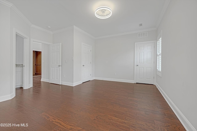 311 S Kingfisher Ln, Hampstead, NC 28443 - spare room featuring crown molding and dark wood-type flooring