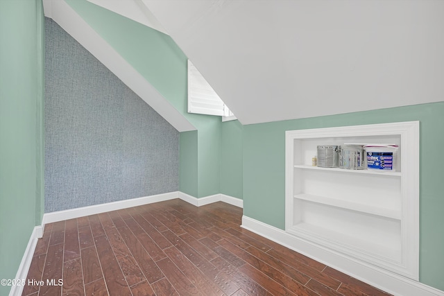 311 S Kingfisher Ln, Hampstead, NC 28443 - additional living space featuring lofted ceiling, wood finished floors, and built in features