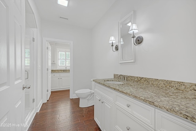 311 S Kingfisher Ln, Hampstead, NC 28443 - full bathroom featuring vanity and wood-type flooring