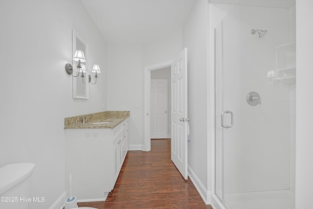 311 S Kingfisher Ln, Hampstead, NC 28443 - full bathroom with a stall shower, vanity, and wood finished floors