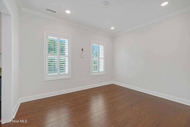 311 S Kingfisher Ln, Hampstead, NC 28443 - spare room with dark wood-style flooring, ornamental molding, and recessed lighting