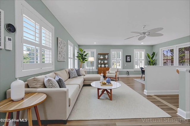 311 S Kingfisher Ln, Hampstead, NC 28443 - living area with wood finished floors, ceiling fan, and recessed lighting
