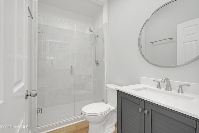 311 S Kingfisher Ln, Hampstead, NC 28443 - full bath with vanity, a stall shower, and wood finished floors