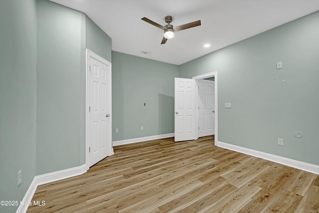 311 S Kingfisher Ln, Hampstead, NC 28443 - unfurnished bedroom with light wood-type flooring, recessed lighting, and ceiling fan