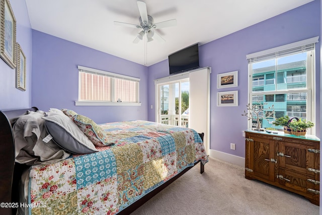 1602 Carolina Beach Ave N Unit 2, Carolina Beach, NC 28428 - carpeted bedroom featuring access to outside and a ceiling fan