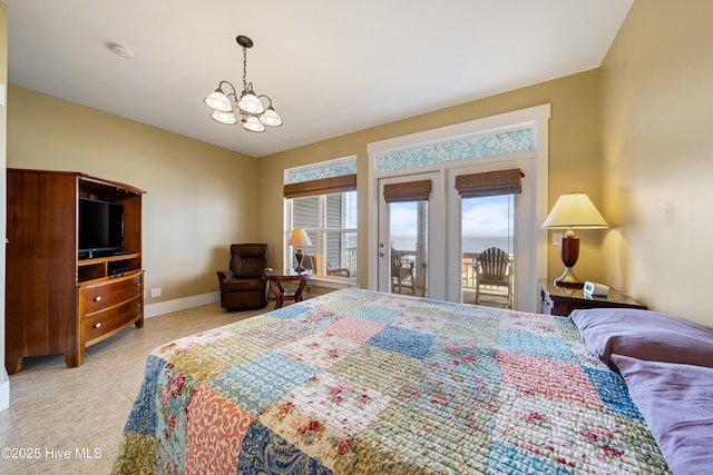 1602 Carolina Beach Ave N Unit 2, Carolina Beach, NC 28428 - bedroom with access to outside, light tile patterned floors, and a chandelier