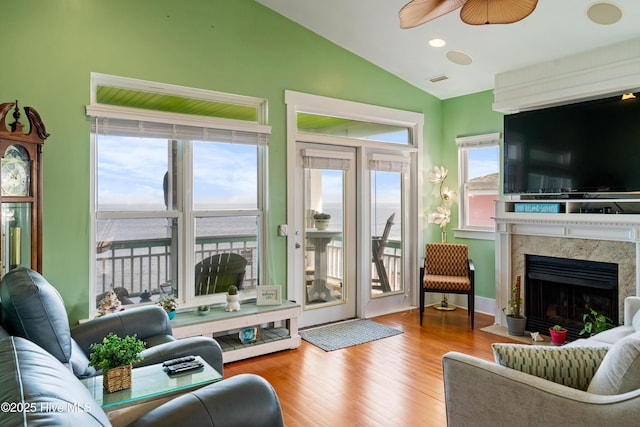 1602 Carolina Beach Ave N Unit 2, Carolina Beach, NC 28428 - living area with vaulted ceiling, ceiling fan, wood finished floors, and a premium fireplace