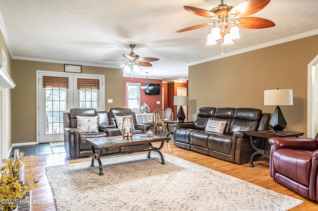 409 S Grace Chapel Church Rd, Hamlet, NC 28345 - living area featuring a ceiling fan, light wood-style flooring, crown molding, and a textured ceiling