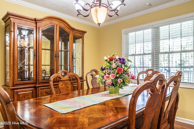 409 S Grace Chapel Church Rd, Hamlet, NC 28345 - dining room with a chandelier, crown molding, and wood finished floors