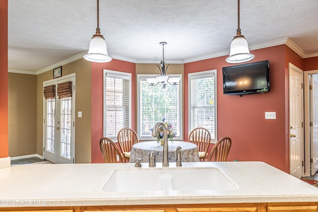 409 S Grace Chapel Church Rd, Hamlet, NC 28345 - dining space with ornamental molding and a textured ceiling
