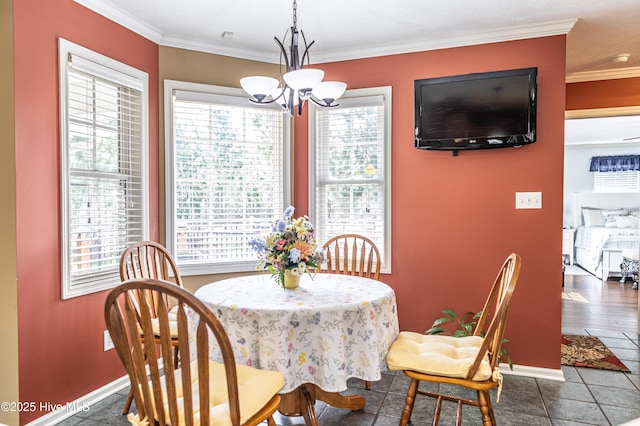 409 S Grace Chapel Church Rd, Hamlet, NC 28345 - dining area featuring a chandelier, crown molding, and dark tile patterned flooring