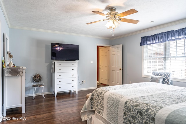 409 S Grace Chapel Church Rd, Hamlet, NC 28345 - bedroom with dark wood-style floors, crown molding, ceiling fan, and a textured ceiling