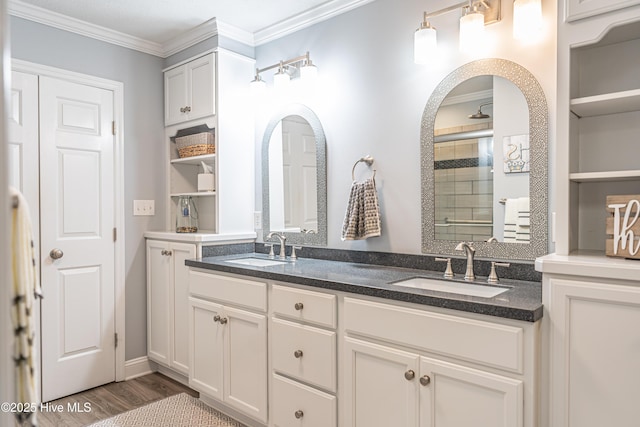 409 S Grace Chapel Church Rd, Hamlet, NC 28345 - full bathroom featuring tiled shower, double vanity, crown molding, and wood finished floors