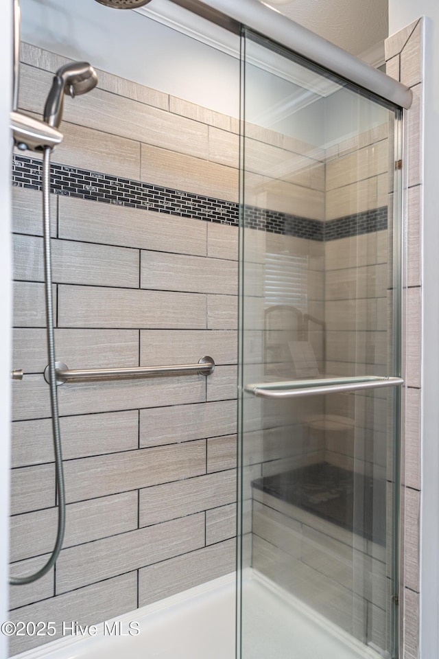 409 S Grace Chapel Church Rd, Hamlet, NC 28345 - full bathroom with a shower stall and crown molding