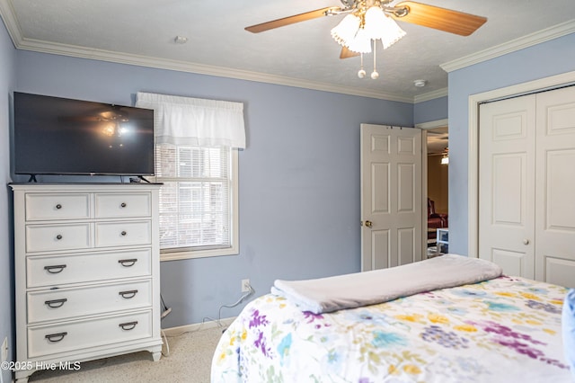 409 S Grace Chapel Church Rd, Hamlet, NC 28345 - bedroom with a closet, carpet floors, ornamental molding, and ceiling fan
