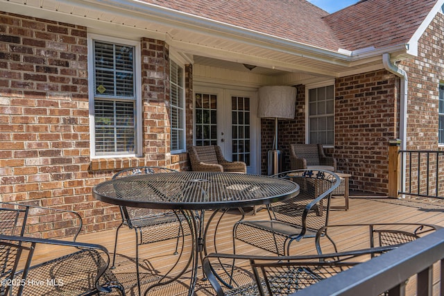 409 S Grace Chapel Church Rd, Hamlet, NC 28345 - wooden deck featuring french doors and outdoor dining area