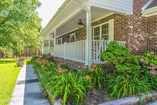 409 S Grace Chapel Church Rd, Hamlet, NC 28345 - view of home's exterior featuring ceiling fan, covered porch, brick siding, and a lawn