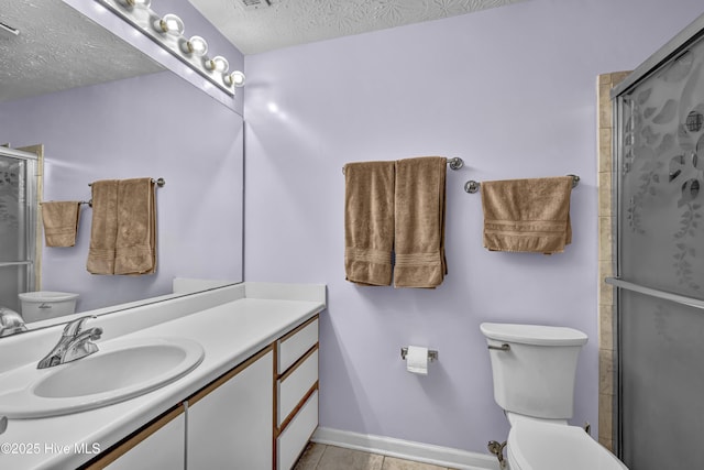 4606 White Ibis Ct, Wilmington, NC 28412 - full bathroom featuring vanity, a shower with door, a textured ceiling, and tile patterned floors