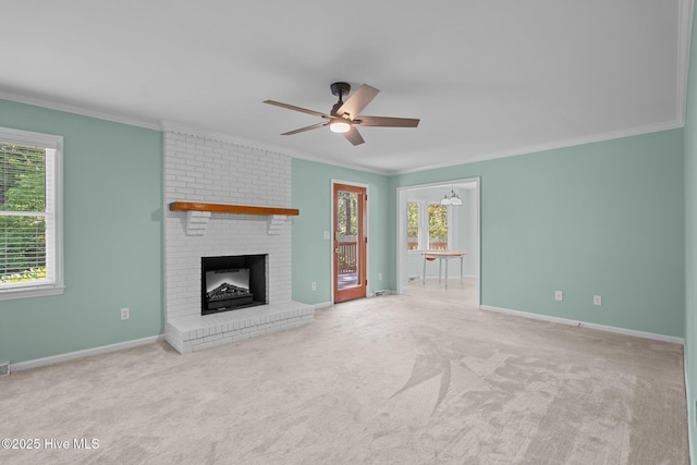 3313 Aster Ct, Wilmington, NC 28409 - unfurnished living room featuring crown molding, ceiling fan, a fireplace, and carpet flooring