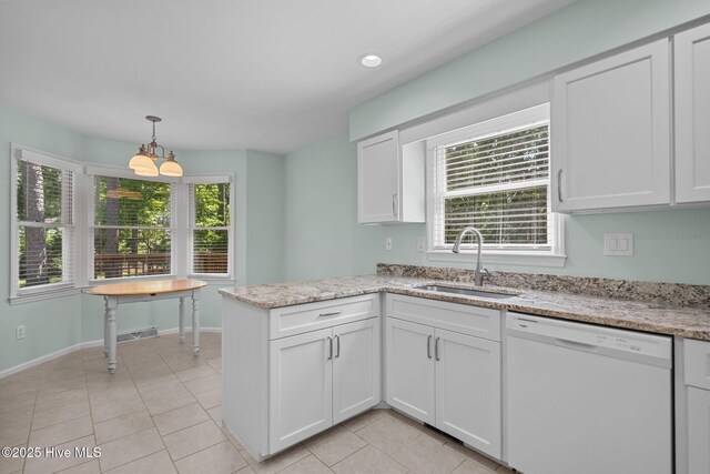 3313 Aster Ct, Wilmington, NC 28409 - kitchen with dishwasher, white cabinets, healthy amount of natural light, a peninsula, and recessed lighting
