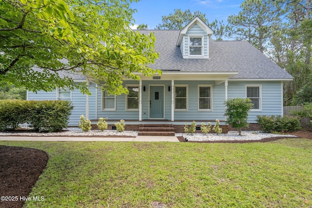 3313 Aster Ct, Wilmington, NC 28409 - new england style home featuring a front lawn, roof with shingles, and a porch