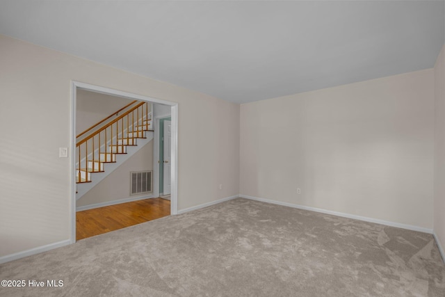 3313 Aster Ct, Wilmington, NC 28409 - spare room featuring carpet and stairway
