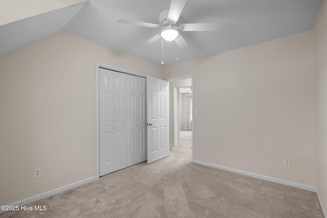 3313 Aster Ct, Wilmington, NC 28409 - unfurnished bedroom featuring carpet floors, a closet, ceiling fan, and vaulted ceiling