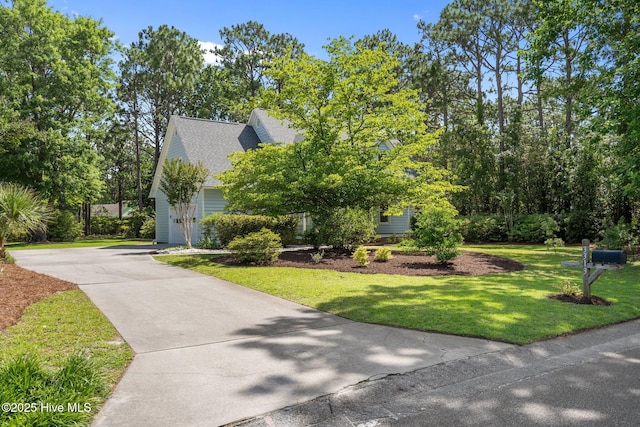 3313 Aster Ct, Wilmington, NC 28409 - view of front of home featuring driveway, a front lawn, and a shingled roof