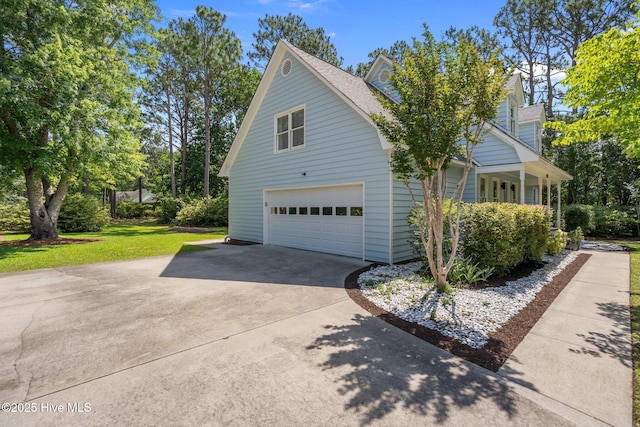 3313 Aster Ct, Wilmington, NC 28409 - view of property exterior featuring concrete driveway, a garage, and roof with shingles