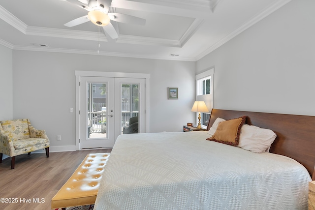 102 SW 4th St, Oak Island, NC 28465 - bedroom with wood finished floors, access to outside, multiple windows, french doors, and crown molding
