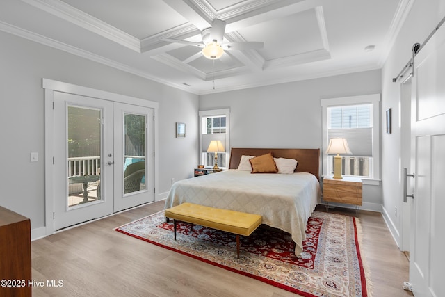 102 SW 4th St, Oak Island, NC 28465 - bedroom featuring light wood-style floors, a barn door, access to exterior, french doors, and coffered ceiling