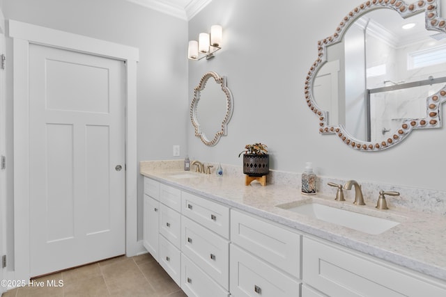 102 SW 4th St, Oak Island, NC 28465 - bathroom with ornamental molding, double vanity, tile patterned floors, and a shower