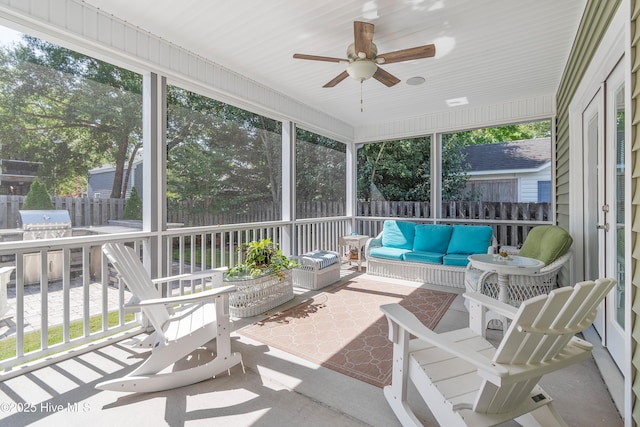102 SW 4th St, Oak Island, NC 28465 - sunroom featuring outdoor lounge area, a ceiling fan, and plenty of natural light