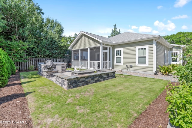 102 SW 4th St, Oak Island, NC 28465 - back of house with a sunroom and roof with shingles