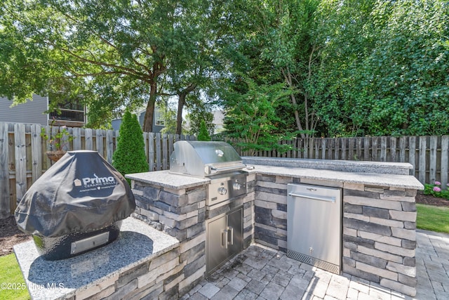 102 SW 4th St, Oak Island, NC 28465 - view of patio / terrace with exterior kitchen