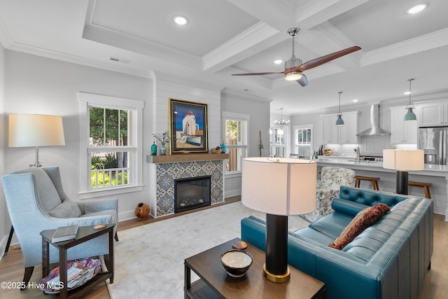 102 SW 4th St, Oak Island, NC 28465 - living room featuring recessed lighting, beamed ceiling, coffered ceiling, light wood-style floors, and a ceiling fan