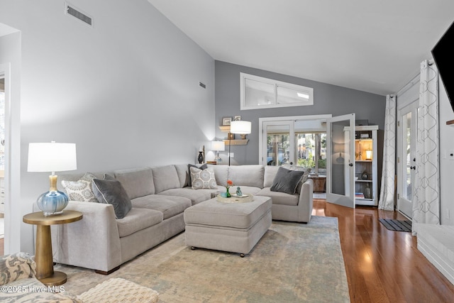 111 Mcginnis Dr, Pine Knoll Shores, NC 28512 - living room with wood finished floors and high vaulted ceiling