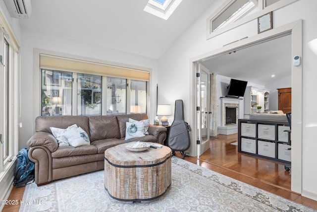 111 Mcginnis Dr, Pine Knoll Shores, NC 28512 - living room featuring a skylight, wood finished floors, a fireplace with raised hearth, an AC wall unit, and high vaulted ceiling